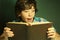 Preteen hansome boy reading book