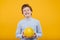 Preteen happy boy with pomelo fruit in hand