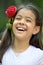 Preteen And Laughter With A Rose