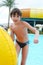 Preteen little boy in open air aqua park