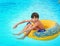 Preteen little boy in open air aqua park