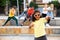 Preteen mulatto girl dancing hip hop with children outdoors