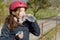 Preteen with roller skate helmet, drink a water