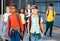 Preteen schoolchildren with rucksacks going to college