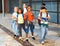 Preteen schoolchildren with rucksacks going to college