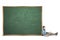 Preteen student sitting with blank chalkboard