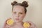 preteenager girl with lemon on yellow background. child with fruit