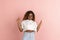 Pretty african american young woman in casual clothes posing on peach backgroung demonstrating various emotions.