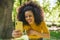Pretty afro girl taking a selfie laughing.