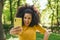 Pretty afro woman taking a selfie laughing.