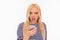 Pretty angry young blonde shouting on her mobile phone