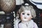 Pretty antique doll with porcelain face and blond hair