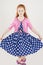 Pretty and Artistic Caucasian Redhaired Girl Posing in Polkadotted Dress