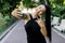 Pretty Asian funny laughing girl with beautiful nude make up and ponytail hair style, showing V sign while taking selfie