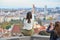 Pretty Asian girl poses and looks at the old city of Prague from observation decks near Prague Castle, Prague, Czech Republic