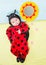 Pretty baby girl, dressed in ladybug costume