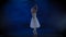 Pretty ballerina in white tutu performing classical ballet. Slow motion.