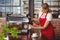 A pretty barista preparing coffee