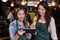 Pretty baristas using tablet