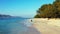 Pretty beauty model on holiday in the sun on beach on sunny blue and white sand 4K background