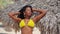 Pretty black girl in yellow bikini