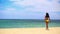 Pretty black girl in yellow bikini going to the sea
