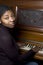 Pretty black woman at piano