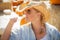 Pretty Blond Female Rancher Wearing Cowboy Hat in Pumpkin Pat