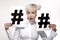 Pretty blond model showing two hashtag sign on paper