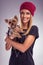 Pretty blond woman dressed in autumn with yorkshire terrier dog