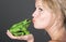 Pretty Blonde Girl Kissing a Frog