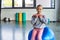 pretty blonde girl sitting on fitness