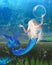 Pretty Blonde Mermaid with underwater background