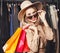 Pretty Blonde Shopaholic Smiling With Shopping Bags