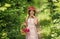 pretty bouquet. gather flower bouquet in basket. happy teen girl in straw hat. childhood happiness.