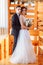 Pretty bride and stylish groom. Gorgeous wedding couple. Luxury dress