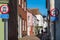 Pretty bright coloured buildings on a fine autumn day. Signs say that motor vehicles are not allowed on