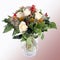 A pretty bunch of white roses and red blossoms in a glass vase