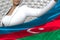 pretty business lady holds Azerbaijan flag in front on the modern architecture background - flag concept 3d illustration