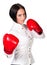 Pretty business woman wearing red boxer gloves