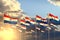 Pretty celebration flag 3d illustration - many Paraguay flags on sunset placed in row with selective focus and space for your