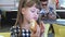 Pretty child girl eating fast food at restaurant.