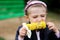 Pretty child girl eats a boiled corn