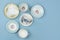 Pretty china teacups on pale blue background