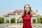 Pretty chinese woman with cheongsam dress talking on the phone at outdoor