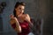 Pretty coquettish pin-up girl eats cherry in retro interior