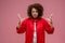 Pretty curly-haired woman in red jacket looking angry