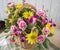 Pretty Easter fresh floral arrangment in wicker basket in natural window light.