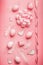 Pretty Easter pink composing with eggs,ribbon,bow, birds and feather on table background, top view
