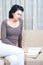 Pretty elegant woman reads book in her room